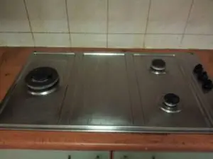 Greasy kitchen stove become shiny after cleaning