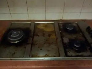 Greasy kitchen stove with many stains